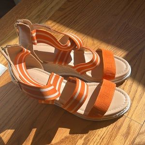 These are super comfortable. The orange is the perfect pop of color!